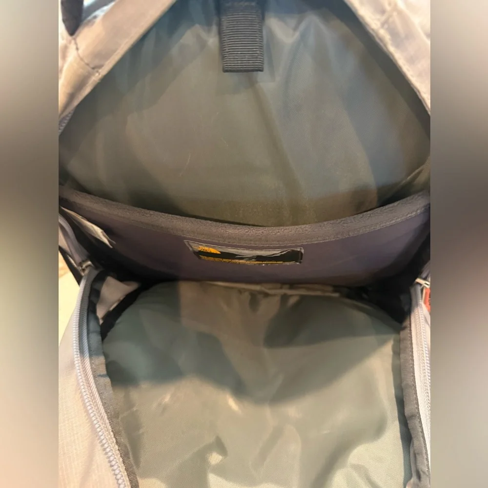 The North Face Gray and Black Backpack with Orange Logo